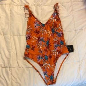 Orange one-piece bathing suit! Flattering!